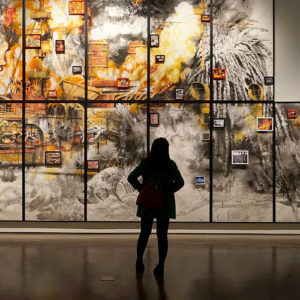 Introvert woman looking at paintings